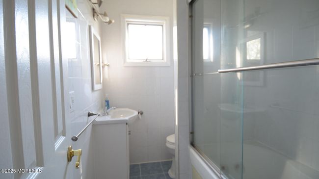 Recent Vanity & Sink. Tiled floor and Walls, Tub & Shower. | Image 25
