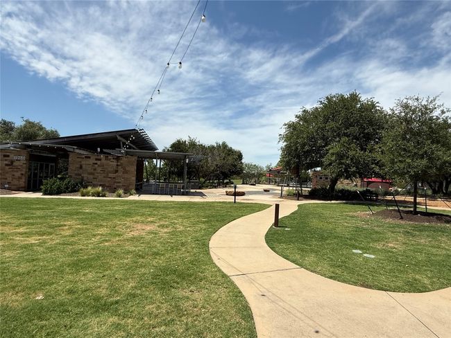 The Backyard, a beautiful Amenity center with splash pad, pool, covered pavilion with free wi-fi, BBQ area, fire pit, pond, picnic tables and playground. | Image 38