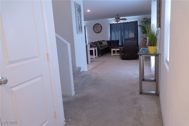 Hallway with stairway and light carpet | Image 6