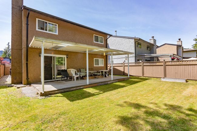 Back of house with stucco siding and a deck | Image 24