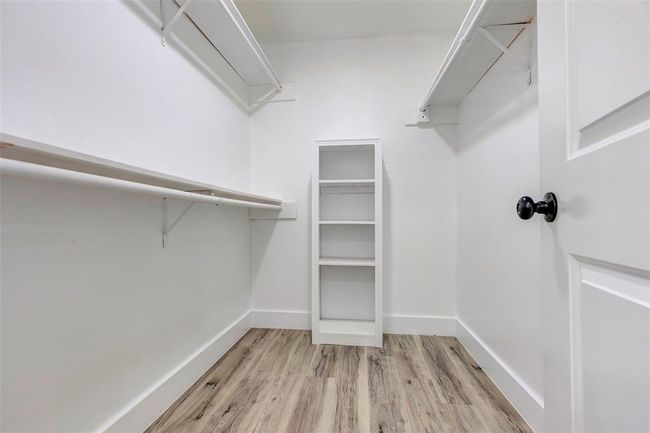 Primary closet with shelves and built ins. | Image 30
