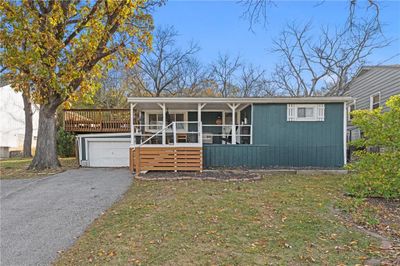 Front of the home with the covered porch. | Image 2