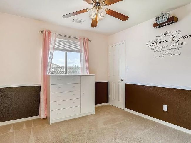 Unfurnished bedroom featuring light carpet, baseboards, and ceiling fan | Image 21
