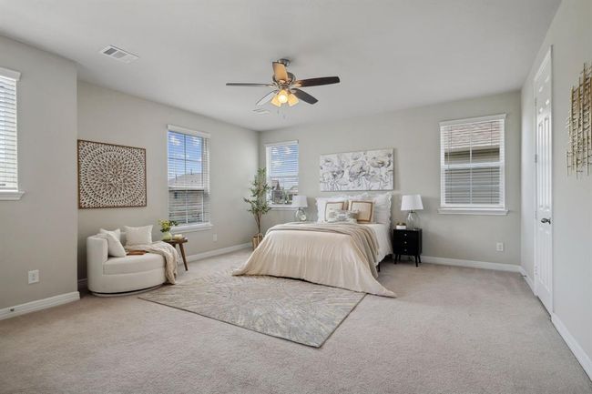 Luxurious primary bedroom. | Image 10