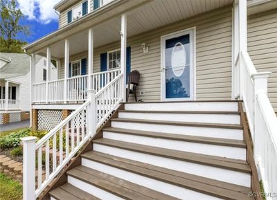 View of exterior entry featuring a porch | Image 2