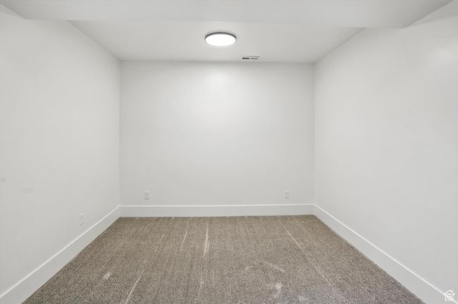 Carpeted spare room featuring baseboards | Image 45