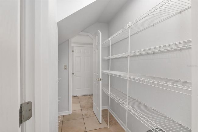 CONVENIENT WALK THRU PANTRY TO BACK HALL AREA | Image 27