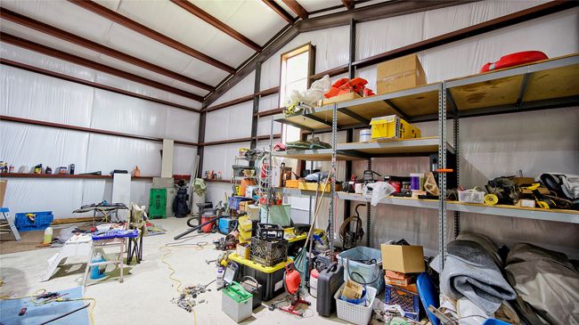 Garage with a workshop area | Image 7