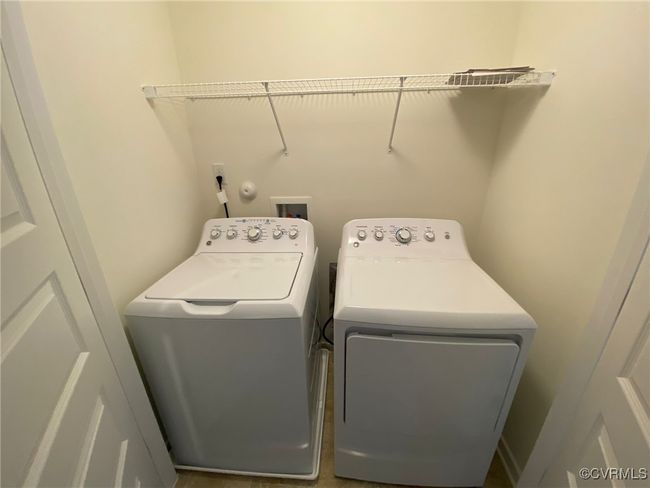 Laundry area with washer and clothes dryer | Image 15