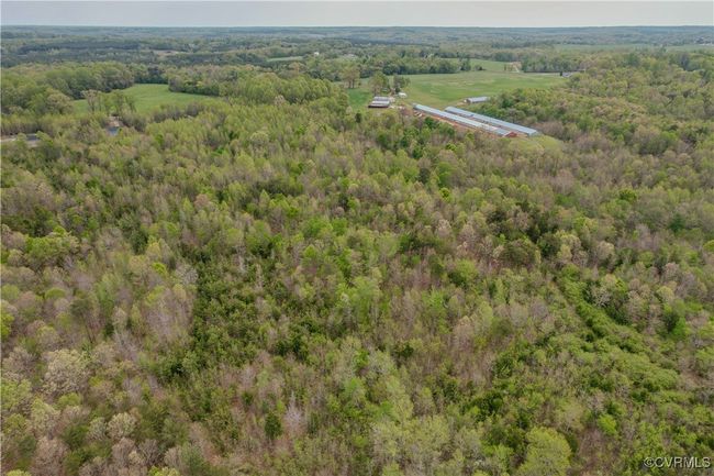 Aerial view featuring a wooded view | Image 18