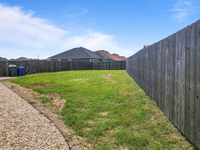 View of fenced backyard | Image 35