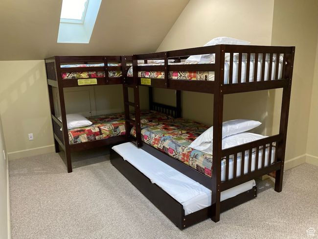 Bedroom featuring vaulted ceiling | Image 22