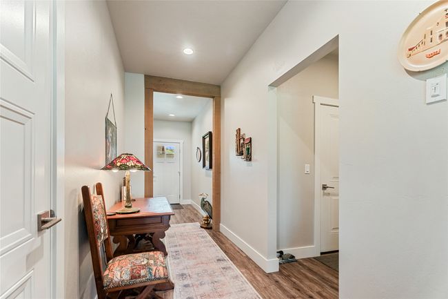 Hallway featuring wood finished floors, baseboards, and recessed lighting | Image 20