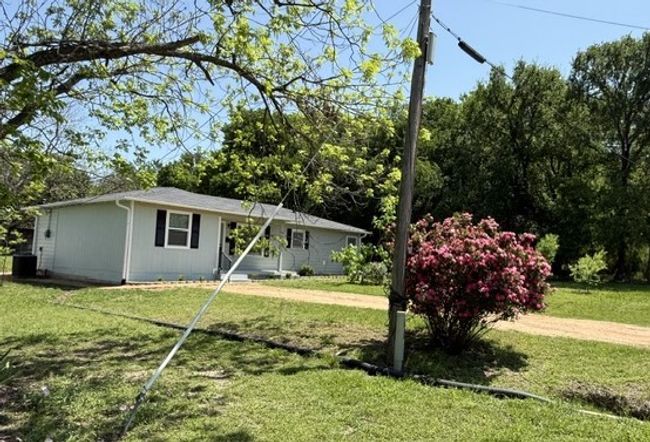 View of front of house with cooling unit and a front yard | Image 22