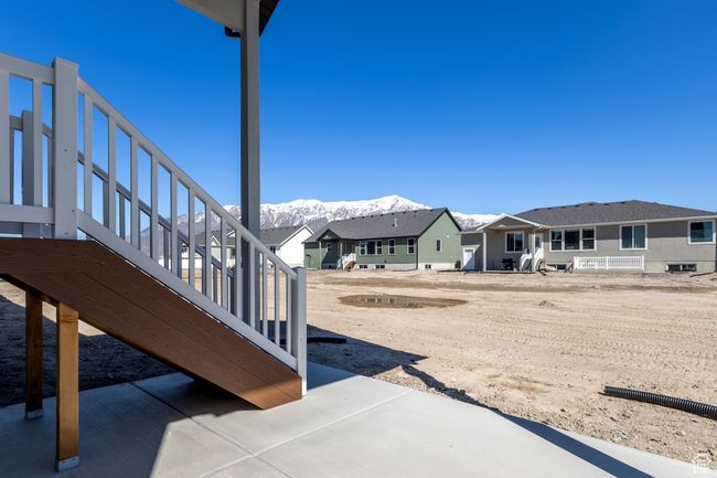 View of yard featuring stairway, a residential view, and a mountain view | Image 25