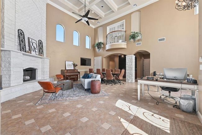 Living area featuring beam ceiling, visible vents, coffered ceiling, and ceiling fan | Image 4