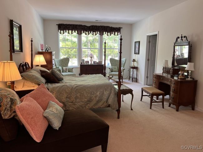 Bedroom with multiple windows and light colored carpet | Image 29