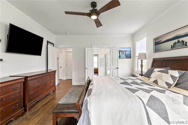 Bedroom featuring ceiling fan, ornamental molding, and dark hardwood / wood-style floors | Image 23
