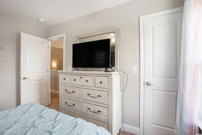 Bedroom with light colored carpet | Image 18