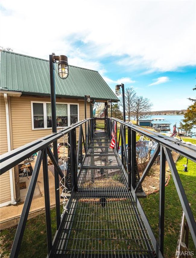 Bridge leading from Sun Room Balcony to Detached Garage. | Image 32