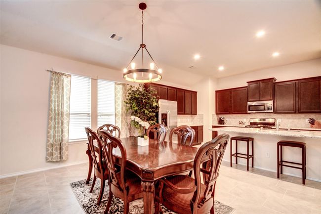 The casual dining area is large enough for dinner parties with friends and family and cozy enough for everyday meals with your family. | Image 11