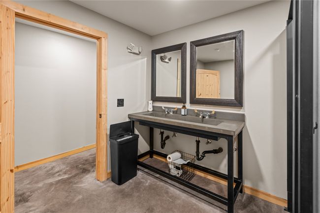 Bathroom featuring concrete floors and baseboards | Image 28