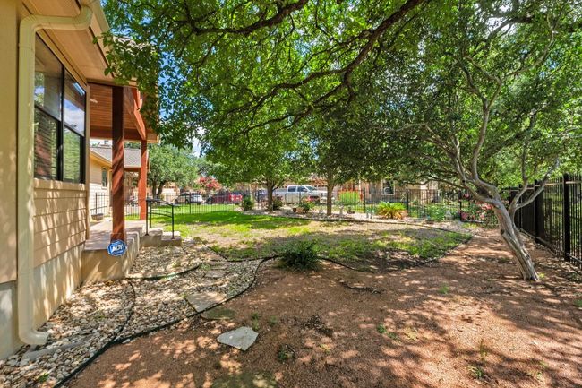 View of fenced backyard | Image 31
