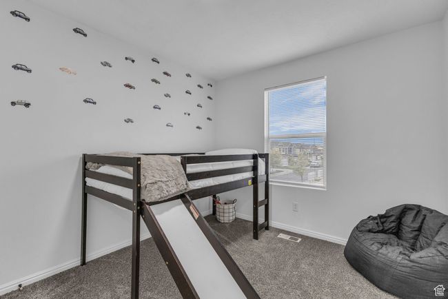 Bedroom with baseboards, visible vents, and carpet flooring | Image 16