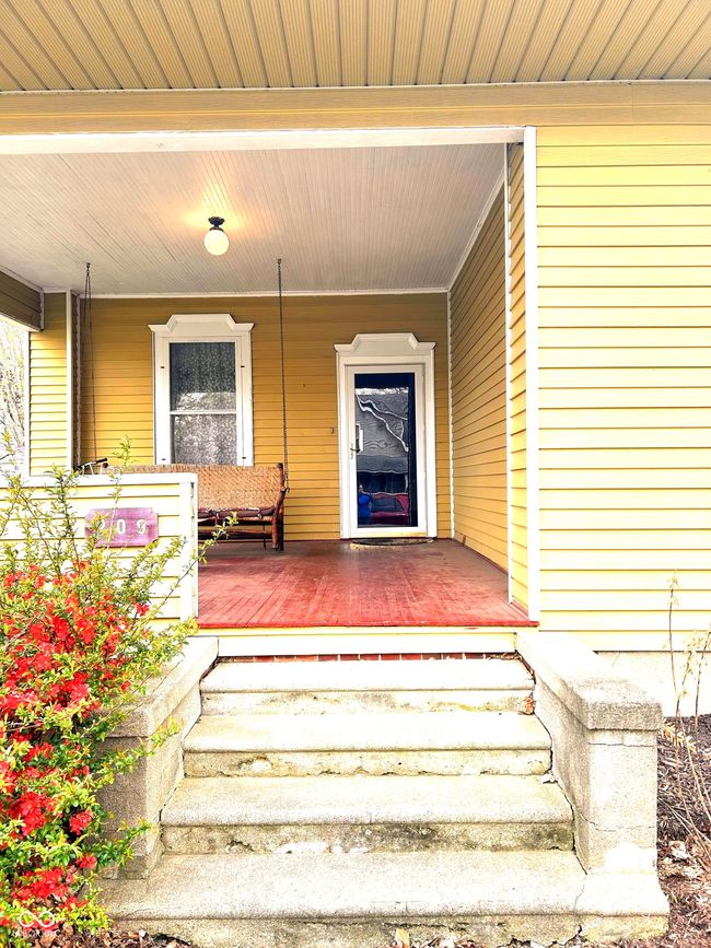 view of exterior entry featuring covered porch | Image 5