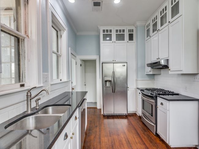 Floor to ceiling cabinets with glass adds character | Image 8