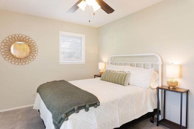 Bedroom featuring ceiling fan, baseboards, and carpet flooring | Image 29