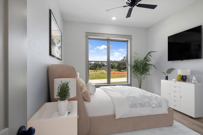 Bedroom with wood finished floors, ceiling fan, and recessed lighting | Image 27
