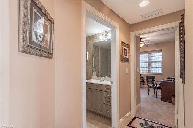 Hall featuring sink and light tile patterned flooring | Image 17