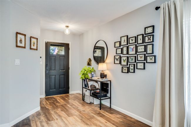 Foyer entrance with wood finished floors and baseboards | Image 5