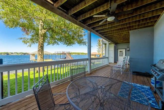 Screened balcony offers plenty of room for cooking and dining. | Image 11