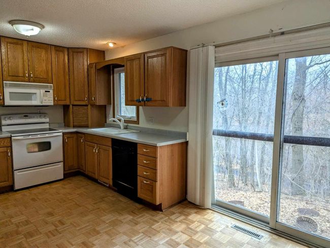Kitchen with no deck off of patio door | Image 5