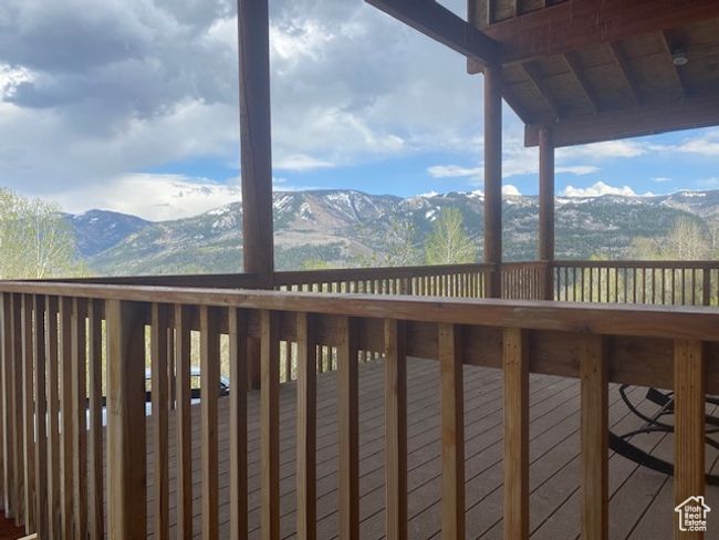Wooden deck featuring a mountain view | Image 12