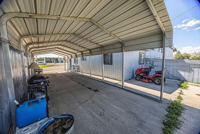 View of parking featuring a carport | Image 17