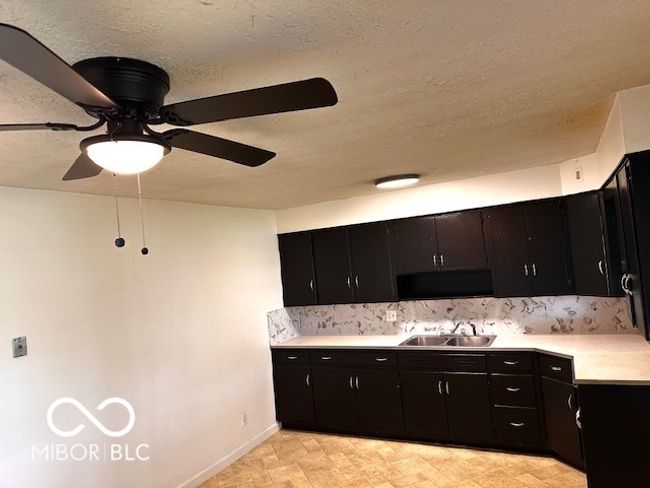 carpeted spare room with baseboards, ceiling fan, and visible vents | Image 14