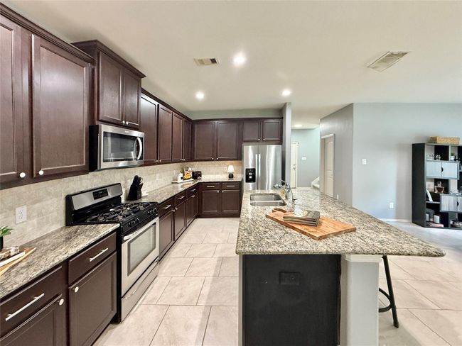Kitchen has recent SS appliances | Image 12
