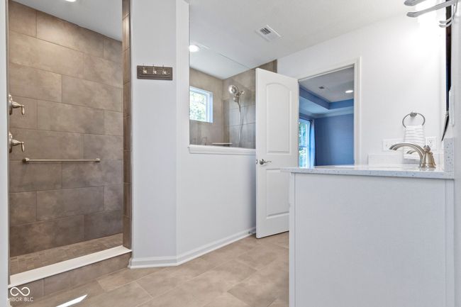 Huge walk in shower with two shower heads gets the day off to a great start! | Image 35