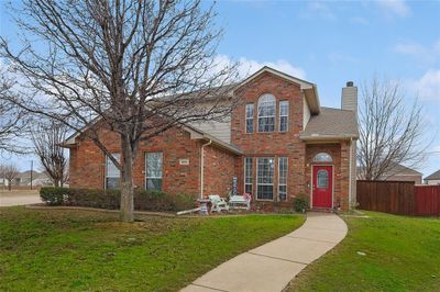 Front facade featuring a front yard | Image 1