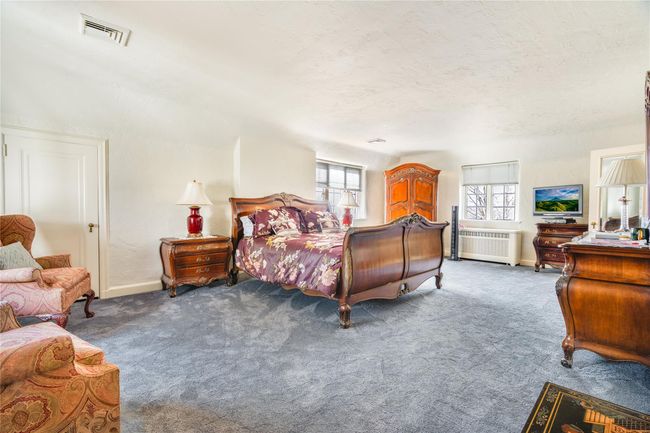 Master bedroom with great natural lighting, a master bathroom, and walk in closet. | Image 13
