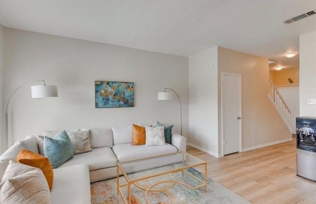 Living room featuring light wood finished floors and stairway | Image 12