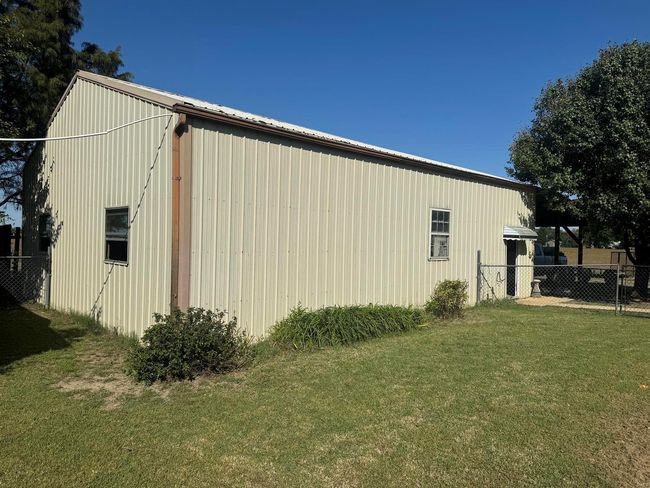 View of side of home with a yard | Image 23