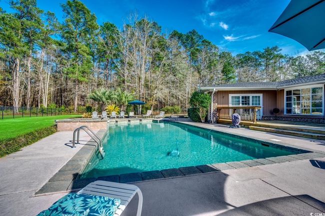 Swimming pool with a patio and a deck | Image 32