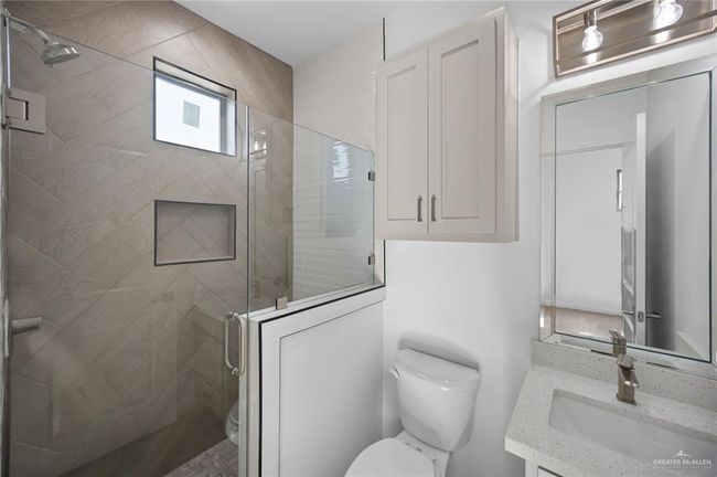 Bathroom featuring vanity and a stall shower | Image 15