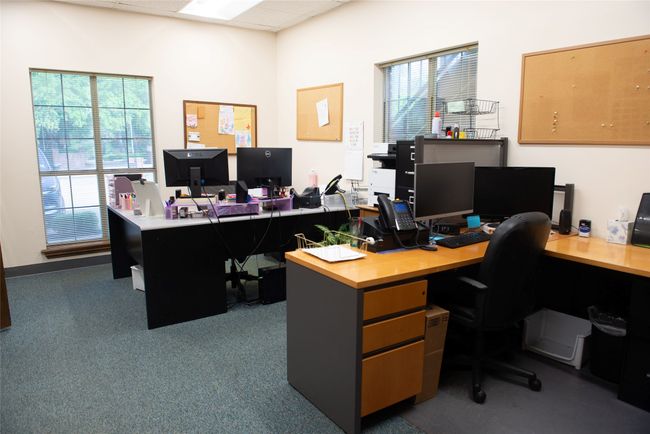 Office with carpet, a drop ceiling, and plenty of natural light | Image 7
