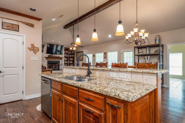 Kitchen with a sink, a ceiling fan, healthy amount of natural light, baseboards, and recessed lighting | Image 18