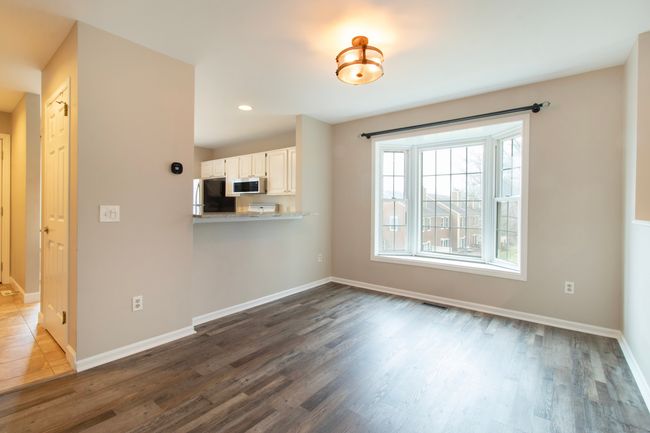 Dining room has space for a generously sized table as well as stools for the granite breakfast bar! | Image 8
